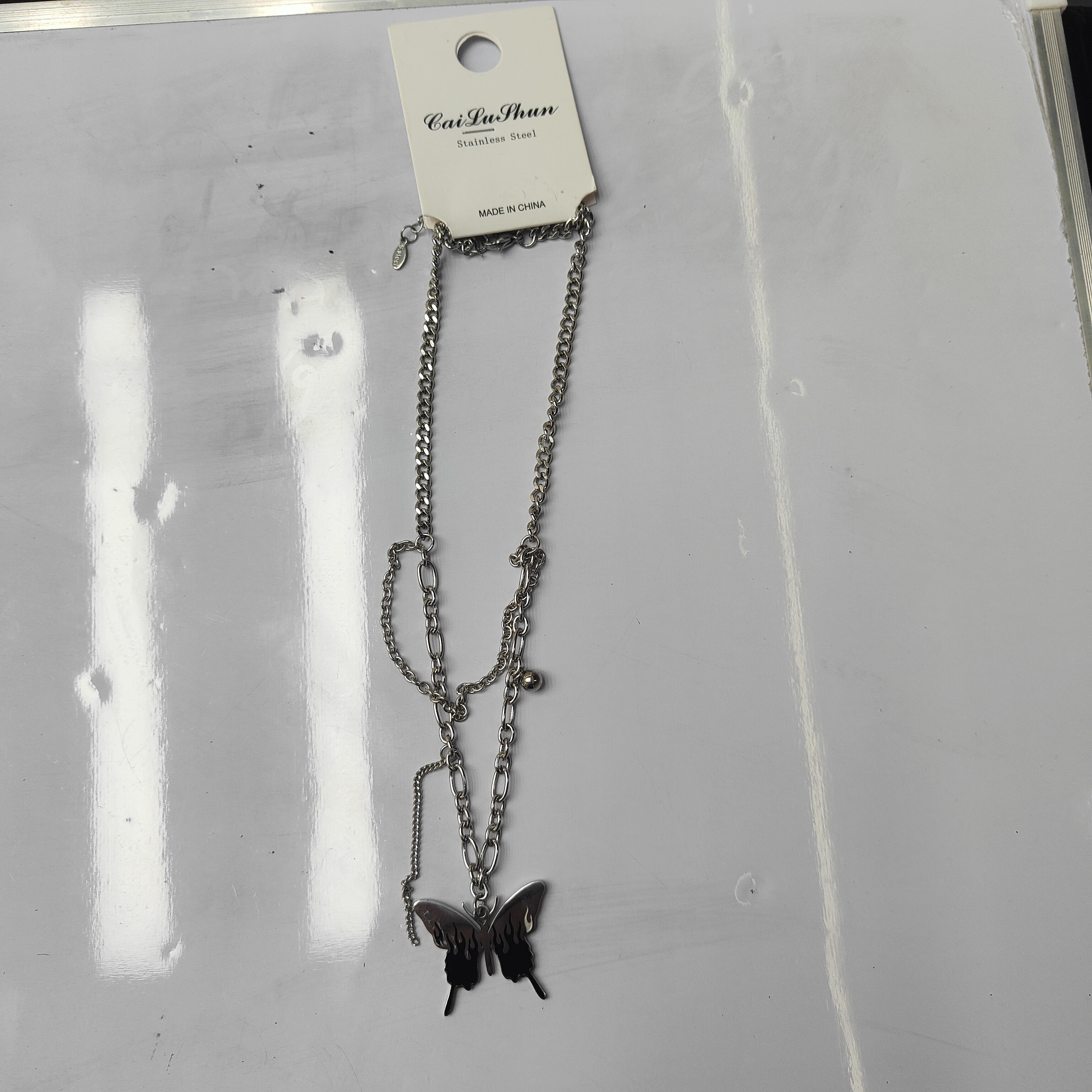 A fashionable stainless steel bestseller, double-layered butterfly necklace, unisex chain tassel accessory for both men and women Specification image