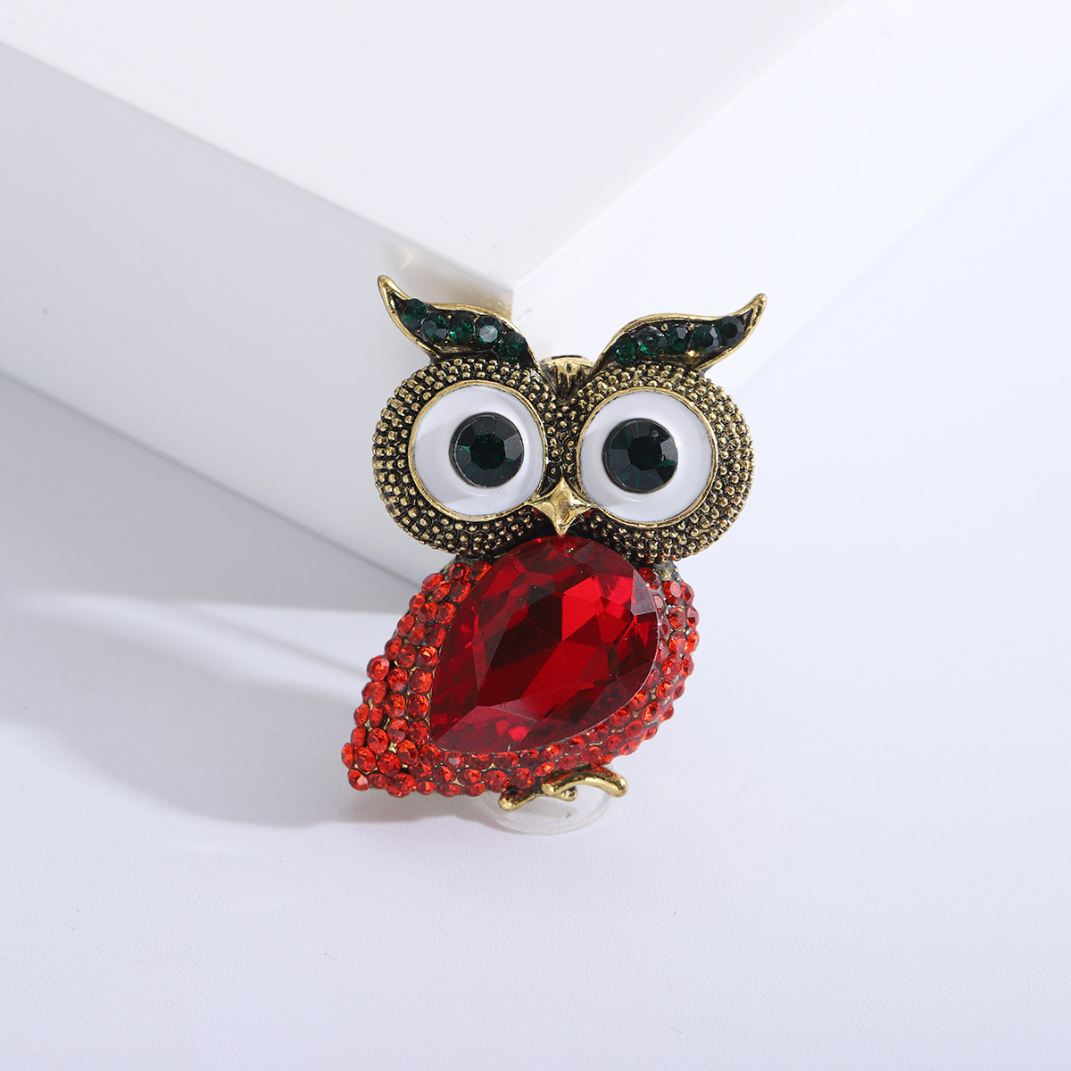 The Owl xi o Pokemon series rose brooch is decorated with blue zircon and features a zircon crown design that is exquisite and fashionable detail image 3
