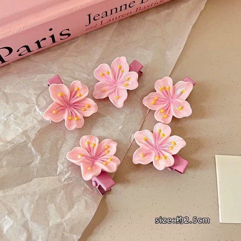 Pink cherry blossom hair clips, a sweet Korean girl's bangs clip headwear, a cute children's peach blossom hair clip edge hair tie detail image 3