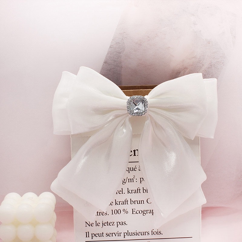 A double-layered black and versatile clothing accessory for women, featuring a small chanel-style French retro diagonal bow tie Specification image