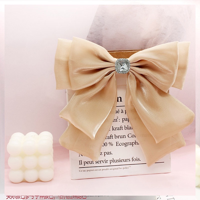 A double-layered black and versatile clothing accessory for women, featuring a small chanel-style French retro diagonal bow tie Application Scenario