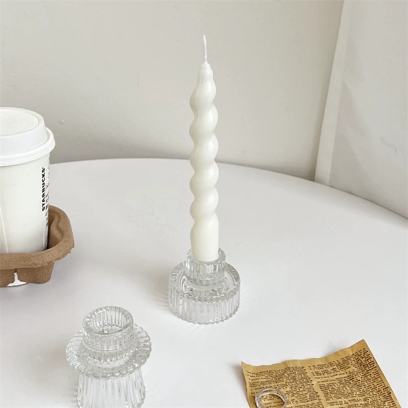 Scented candles, candle holders, decorative cups, and glass candlesticks enhance the home atmosphere, creating a warm and romantic ambience details Picture