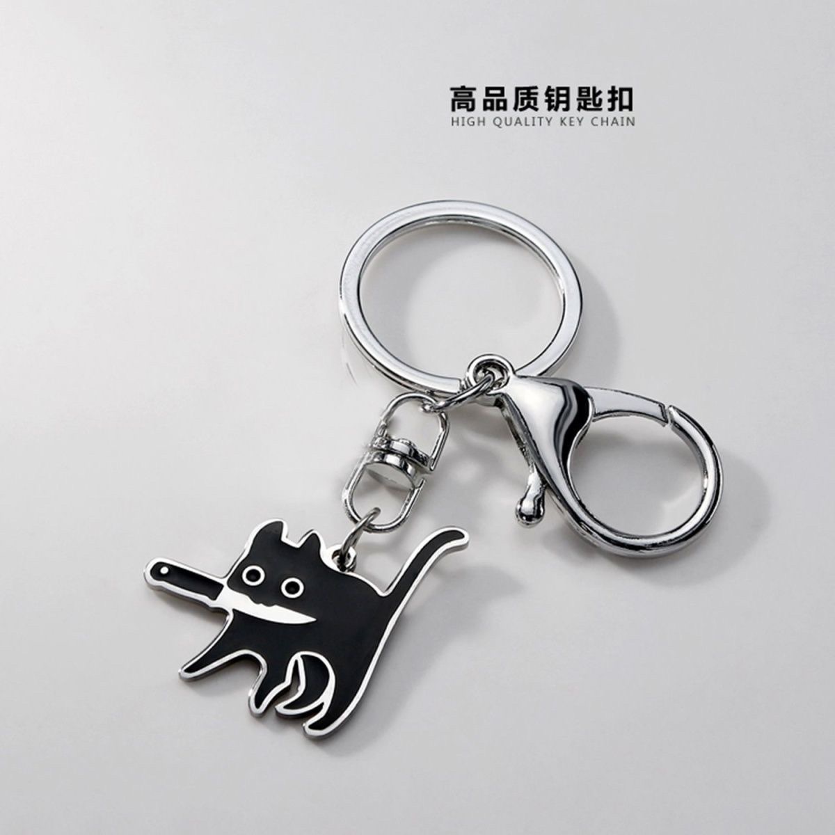 "Creative and personalized keychain keychain accessories, cool car bag pendant, collectible gift with a knife-wielding cat collectible toy. detail image 3