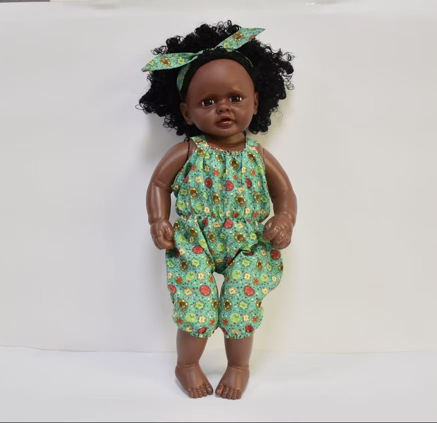 A doll reborn with an empty body and a vinyl body toy