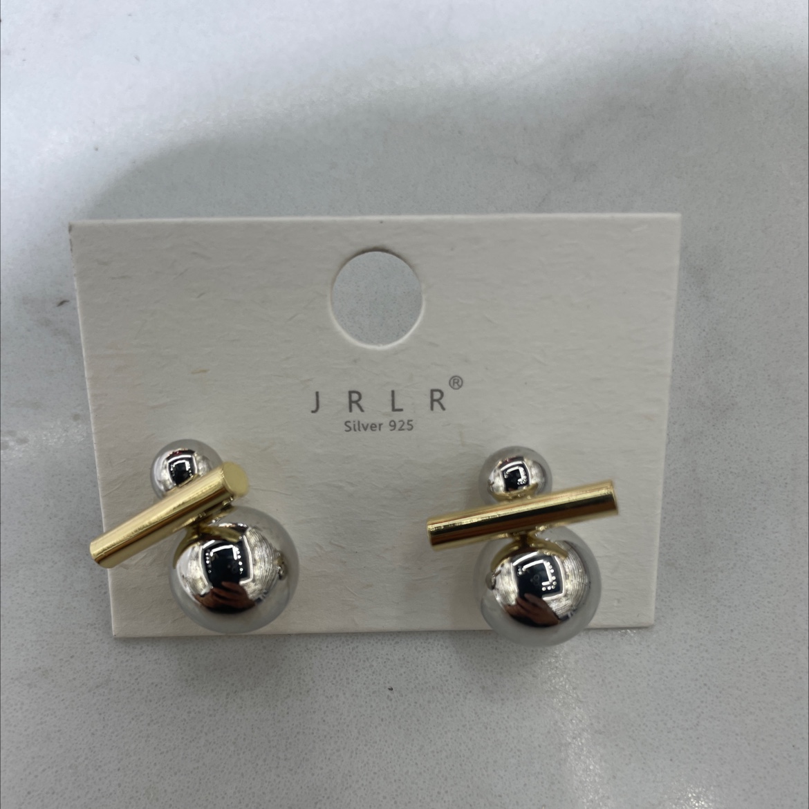 The Korean-style earrings feature a unique two-color design with geometric patterns. The earrings are fashionable and trendy. The ear clips are exquisite, durable and do not fade easily. High-quality materials are used to create personalized style accessories details Picture