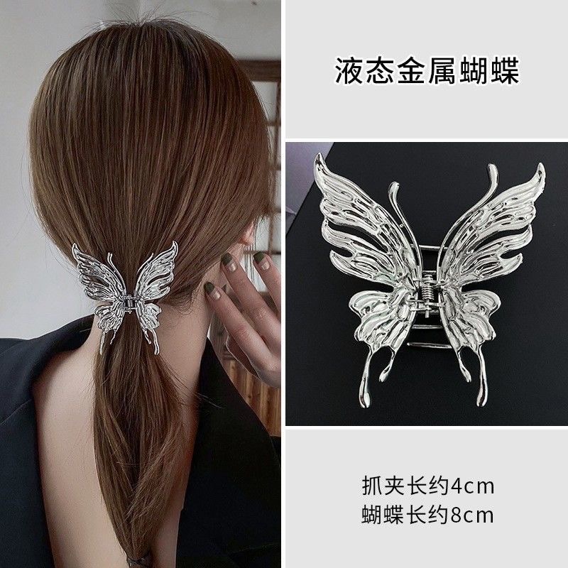 A new liquid metal high-end hair accessory with a grand butterfly grip, featuring a female shark with a water hose at the back of the head