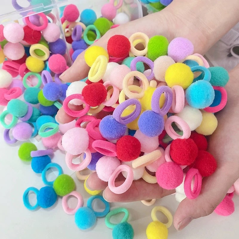 The girl's colorful pom-ball hair band is super cute. The new rubber band is adorable for kindergarten girls. The hair band has a bouncy elasticity detail image 3