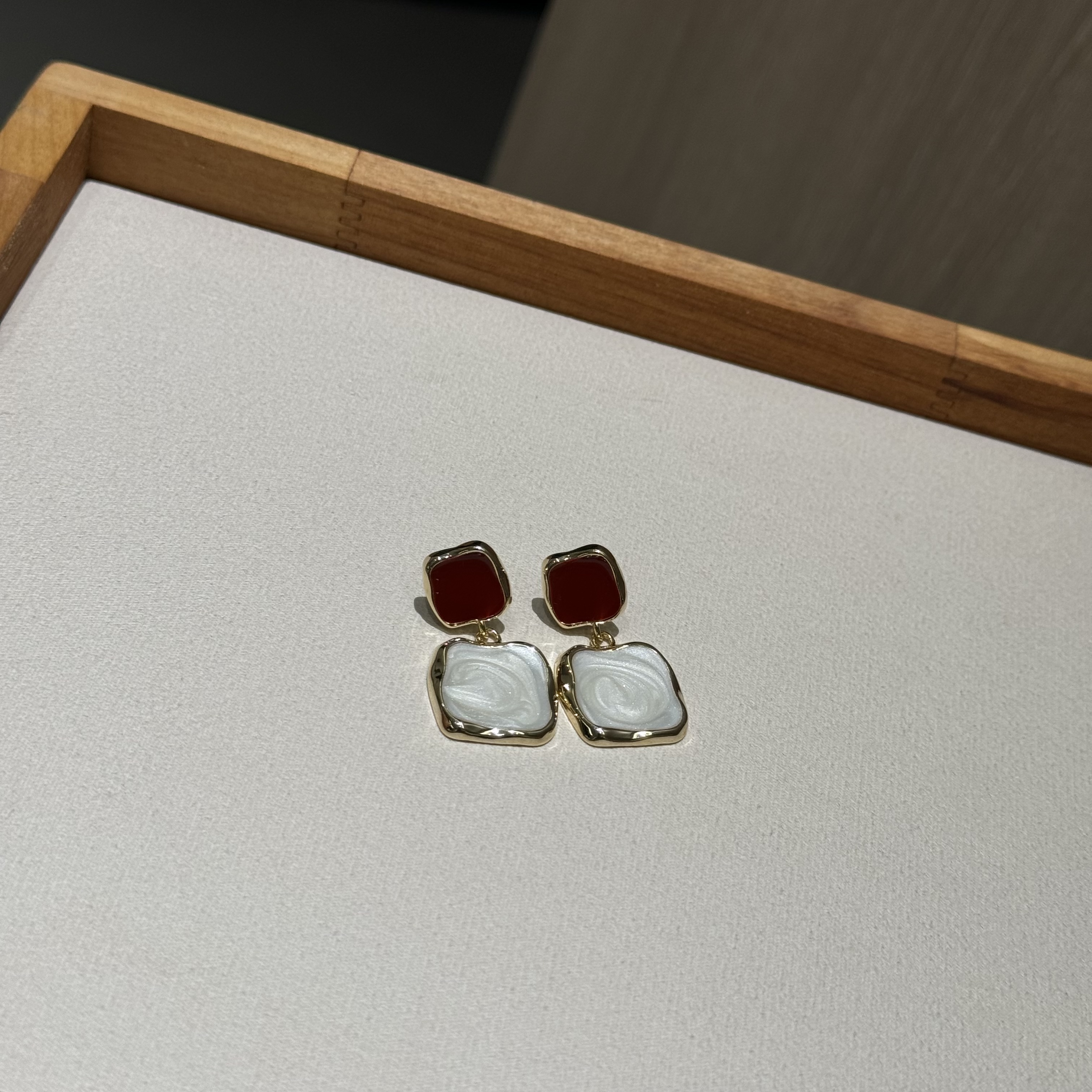 The unique design of the oil-dripping red Christmas and New Year creative earrings with stud earrings is exquisite and fashionable. It is a light luxury daily accessory for women Item Picture