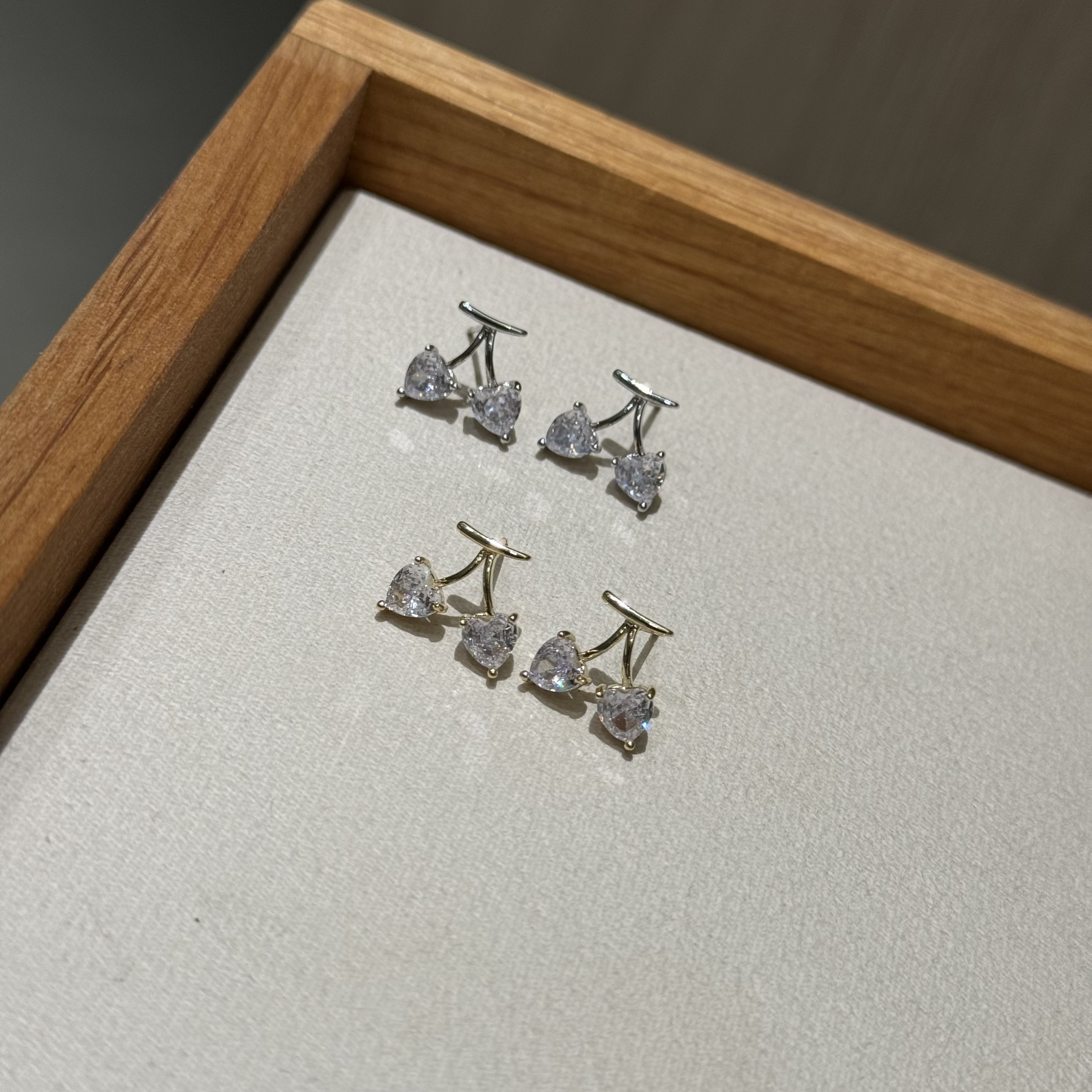 The cherry Zircon style is exquisitely cute with a unique design. The stud earrings are simple and fashionable, making it a refined choice for ladies' jewelry details Picture