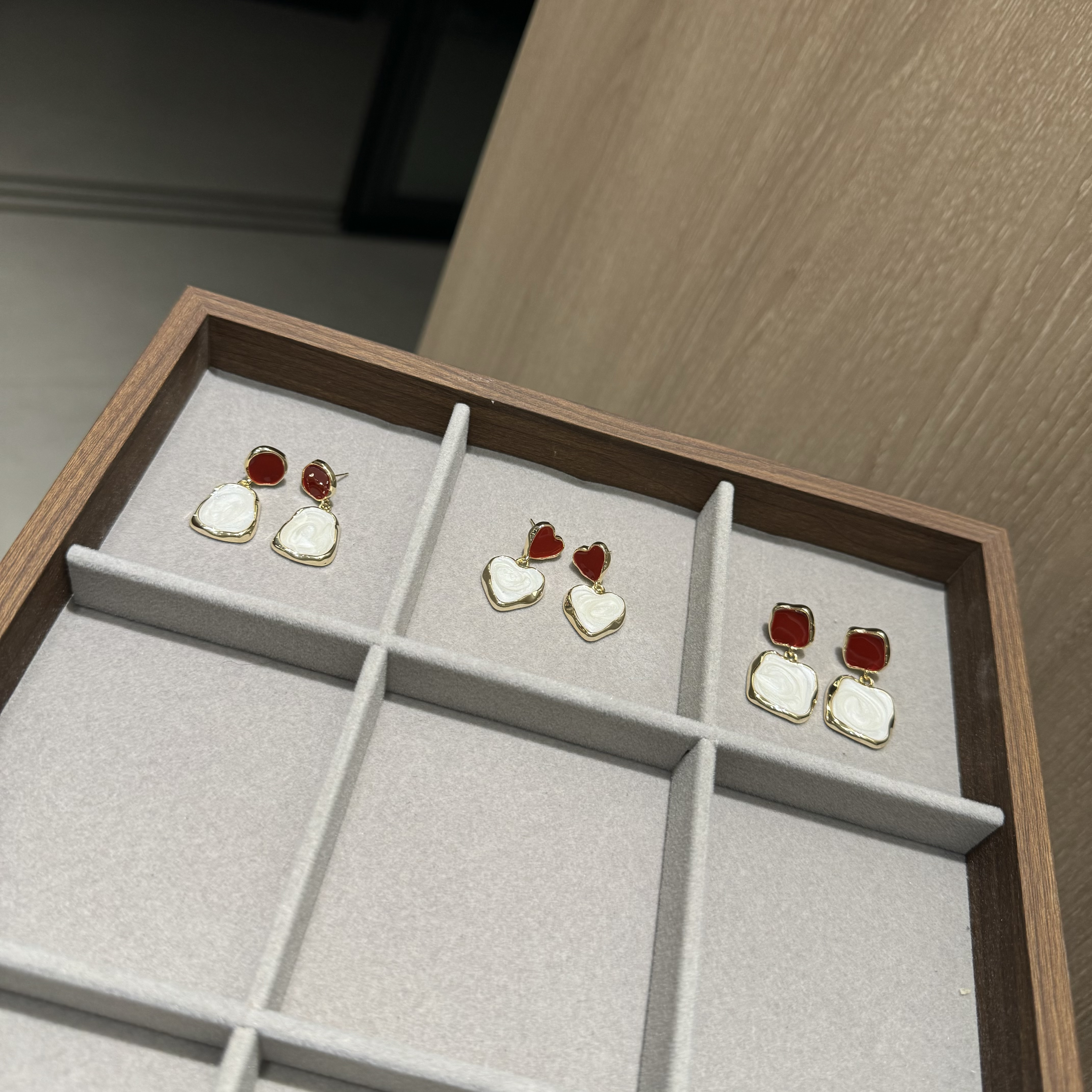 The unique design of the oil-dripping red Christmas and New Year creative earrings with stud earrings is exquisite and fashionable. It is a light luxury daily accessory for women details Picture