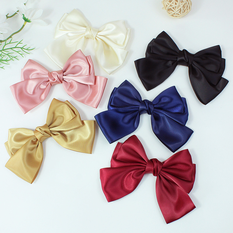 Creative accessories include glossy polyester hair clips, unique hair accessory designs, elegant ladies' hair clips, simple and fashionable headwear decorations