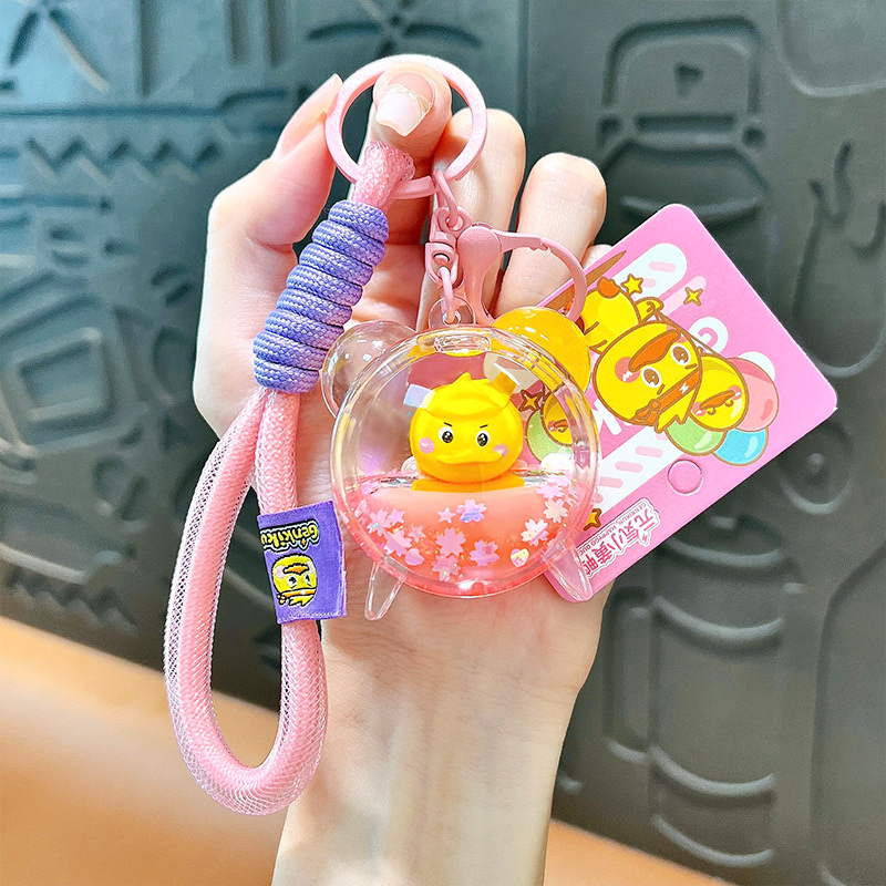 Creative and energetic little yellow duck alarm clock keychain, cute schoolbag pendant, car key chain, small gift wholesale, car pendant, mascot pendant Item Picture