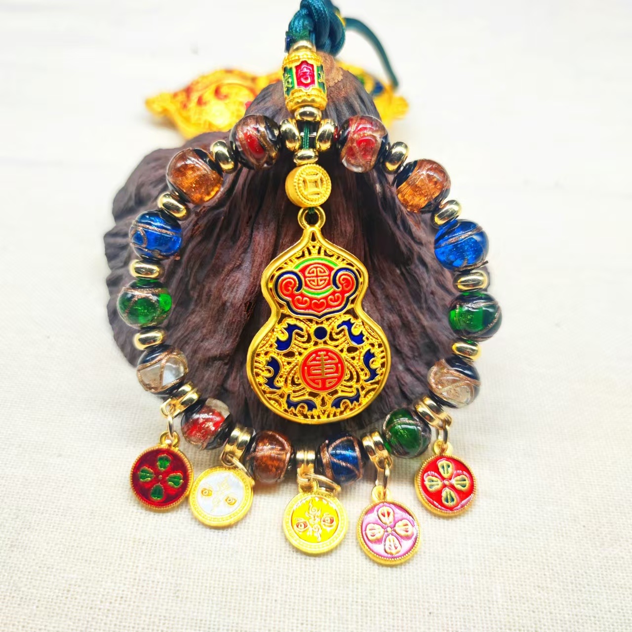 香灰琉璃珐琅彩滴油五路财神
工艺品车挂件白底实物图