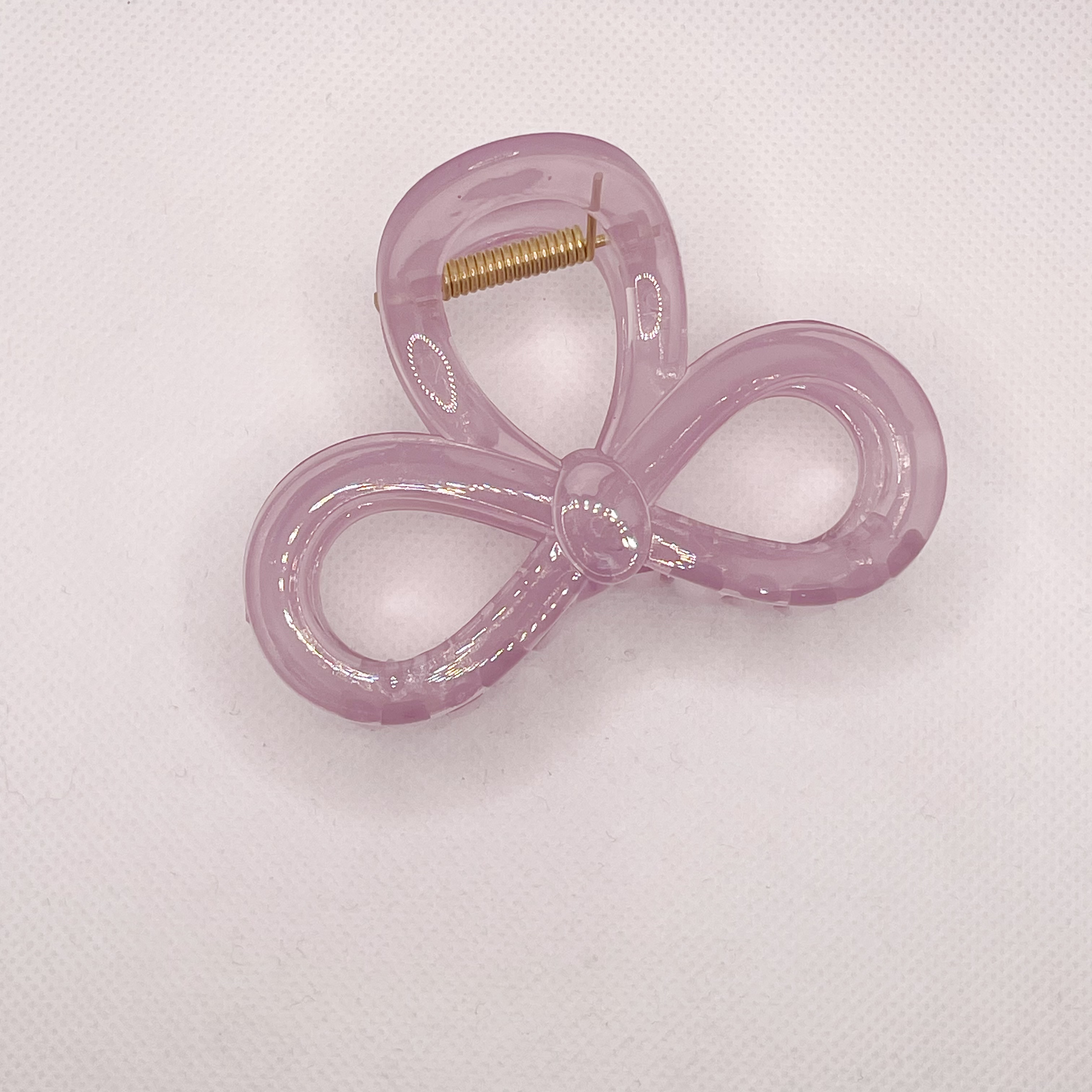 In summer, there is a high-end bow clip for women. The hair volume is small and medium-sized. The hair is coiled at the back of the head. The shark clip is half-tied detail image 10