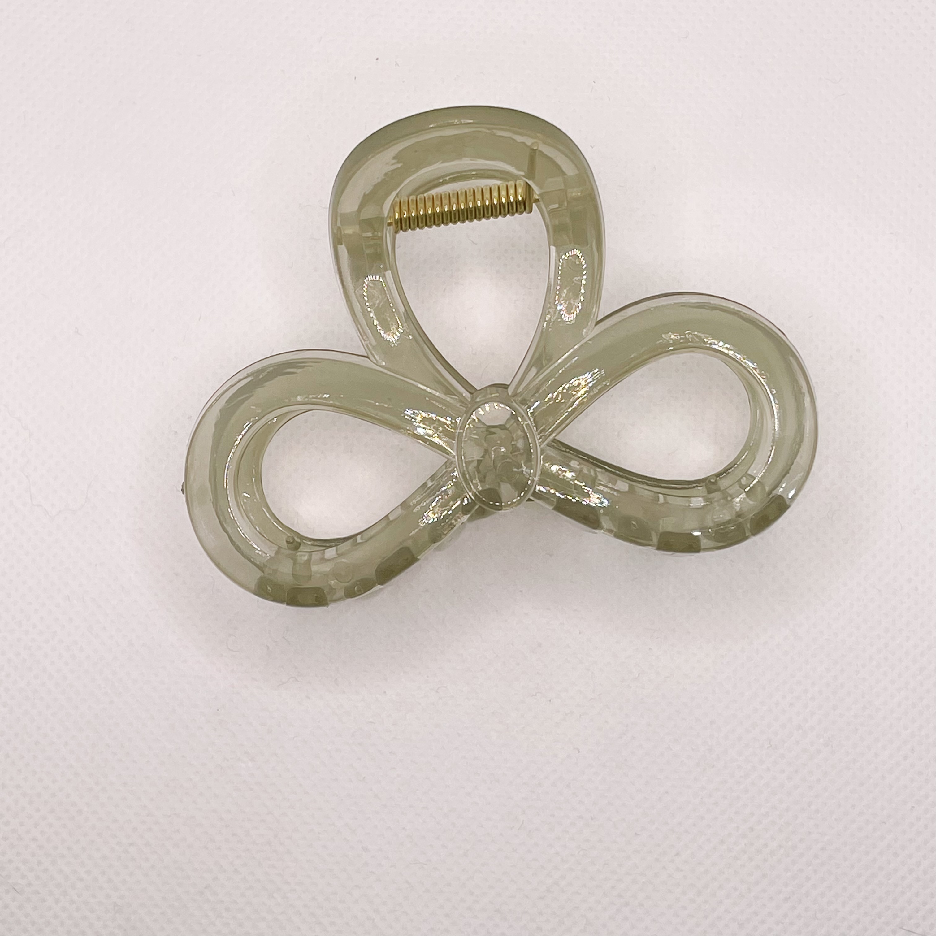 In summer, there is a high-end bow clip for women. The hair volume is small and medium-sized. The hair is coiled at the back of the head. The shark clip is half-tied detail image 5