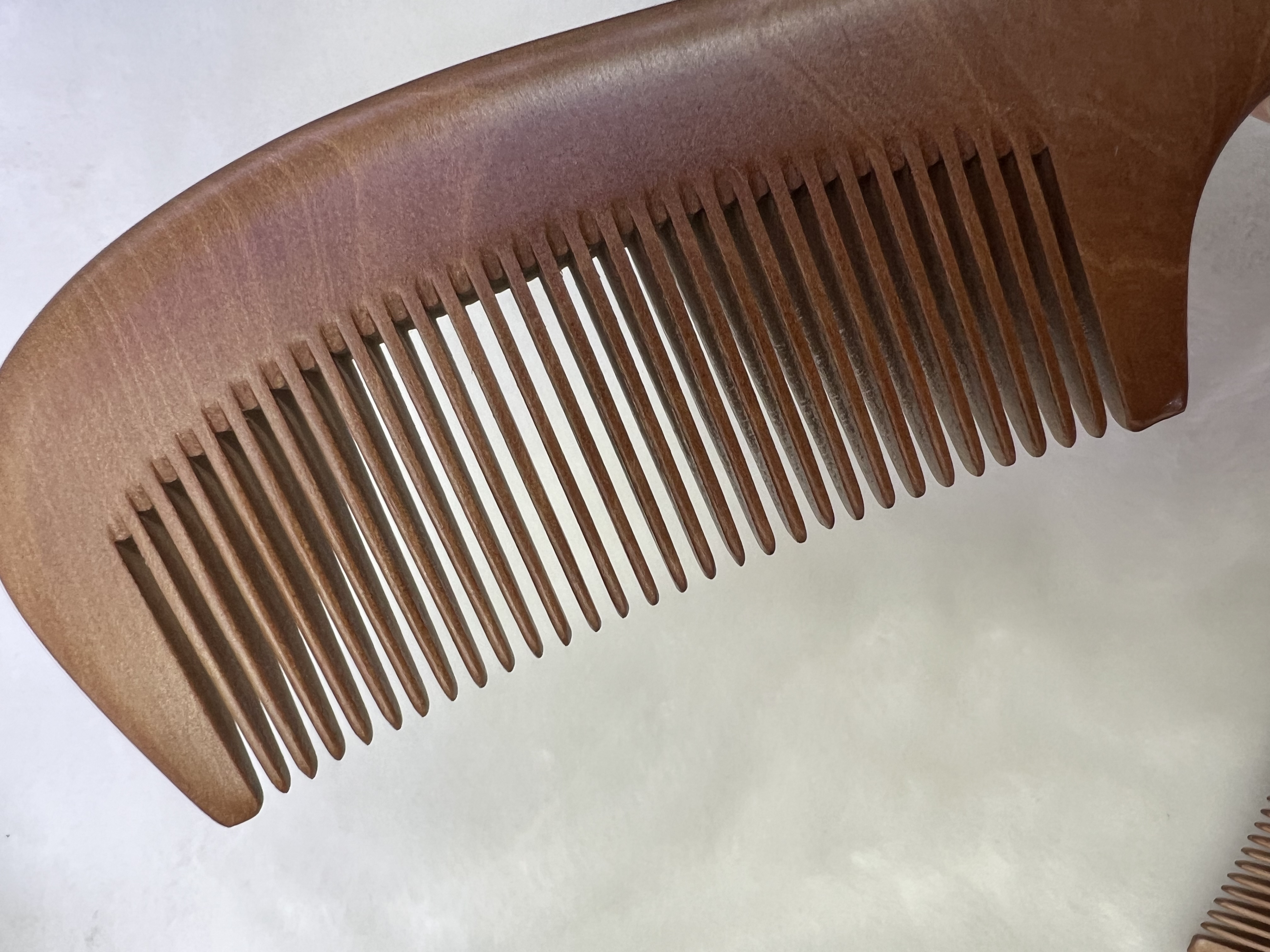 Factory direct sales of natural wood combs, high-quality nanmu combs with handles and fine teeth, household gift combs detail image 8