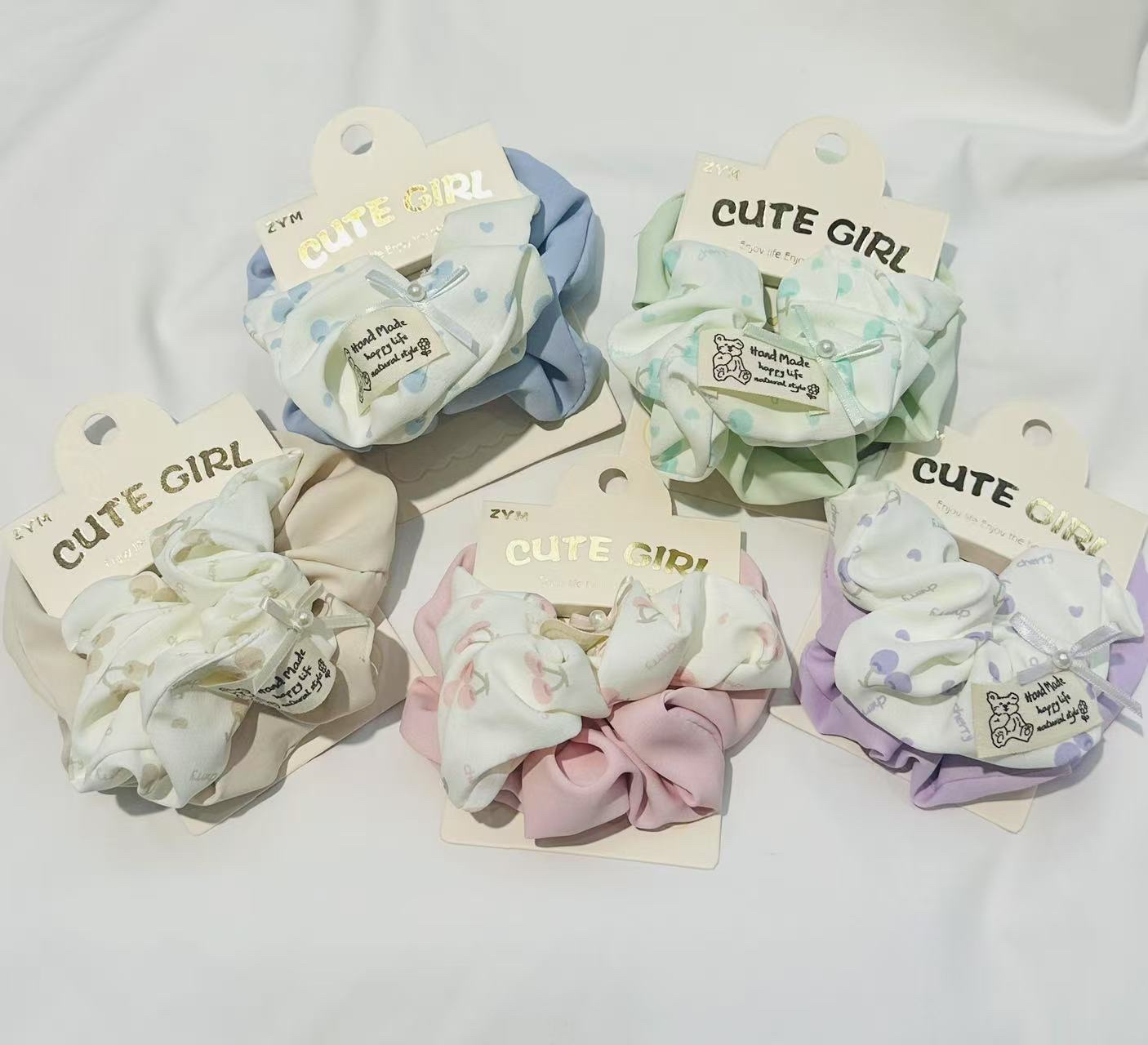Wholesale of new spring and summer hair accessories: A pair of cute and fresh cartoon bear and flower combinations with large intestine rings and fabric