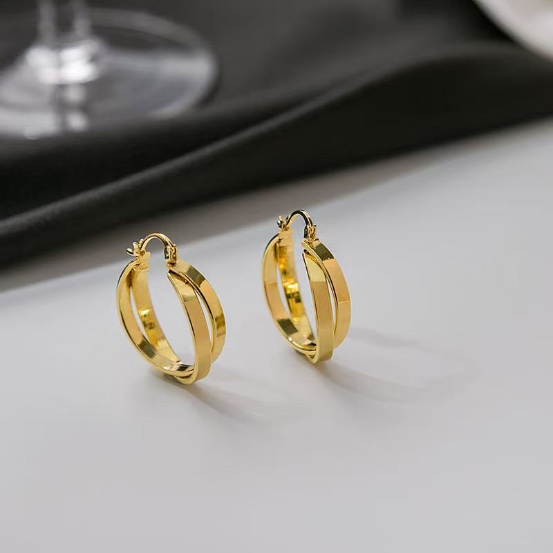 The same golden geometric double-ring ear rings as the "Mad Dog Big Sister"