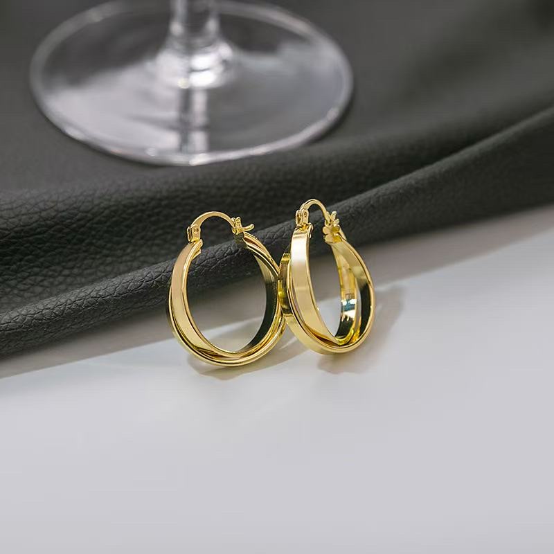 The same golden geometric double-ring ear rings as the "Mad Dog Big Sister" details Picture