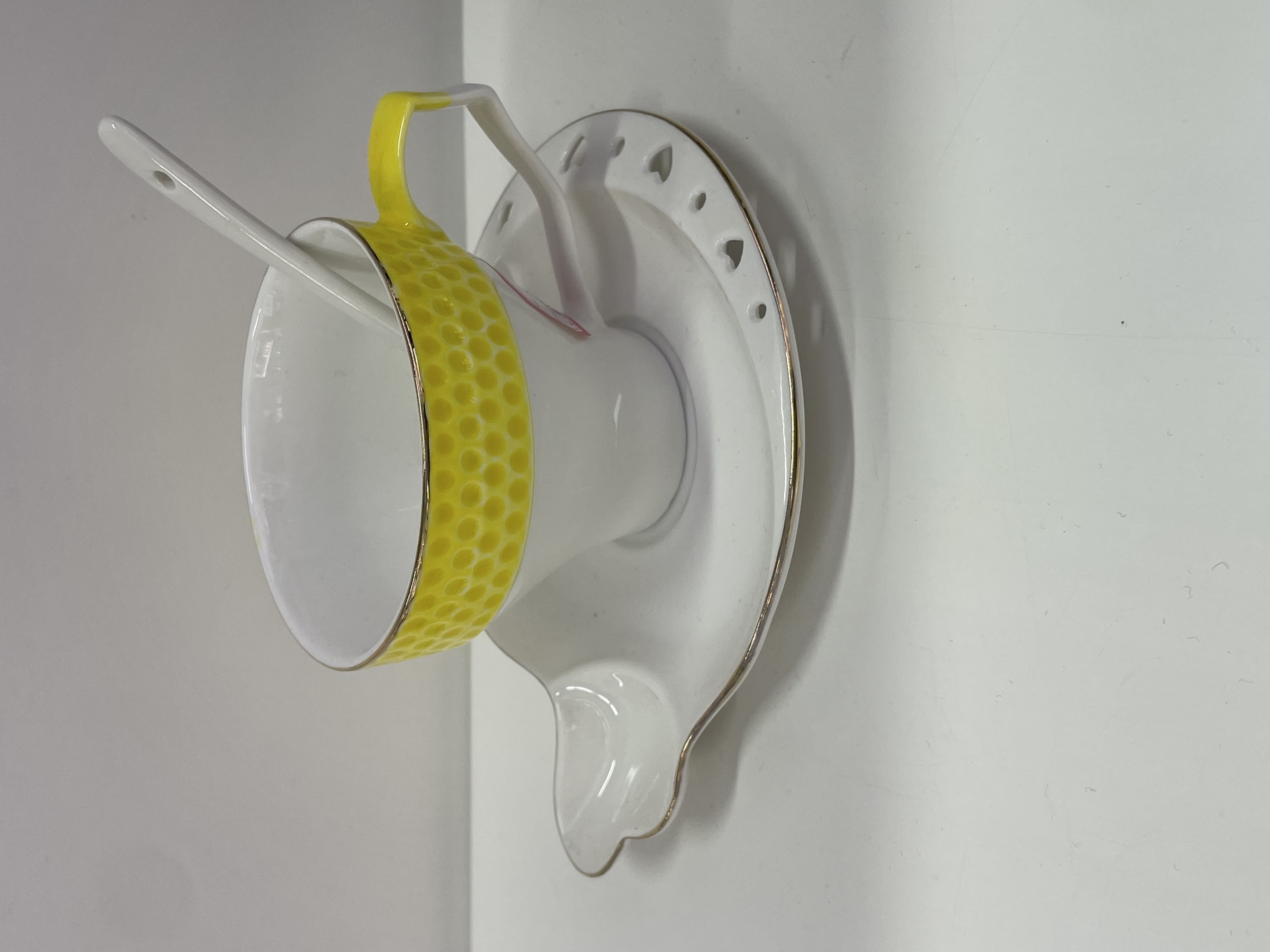 Yellow ceramic cups and plates with gold plating and individual color boxes
