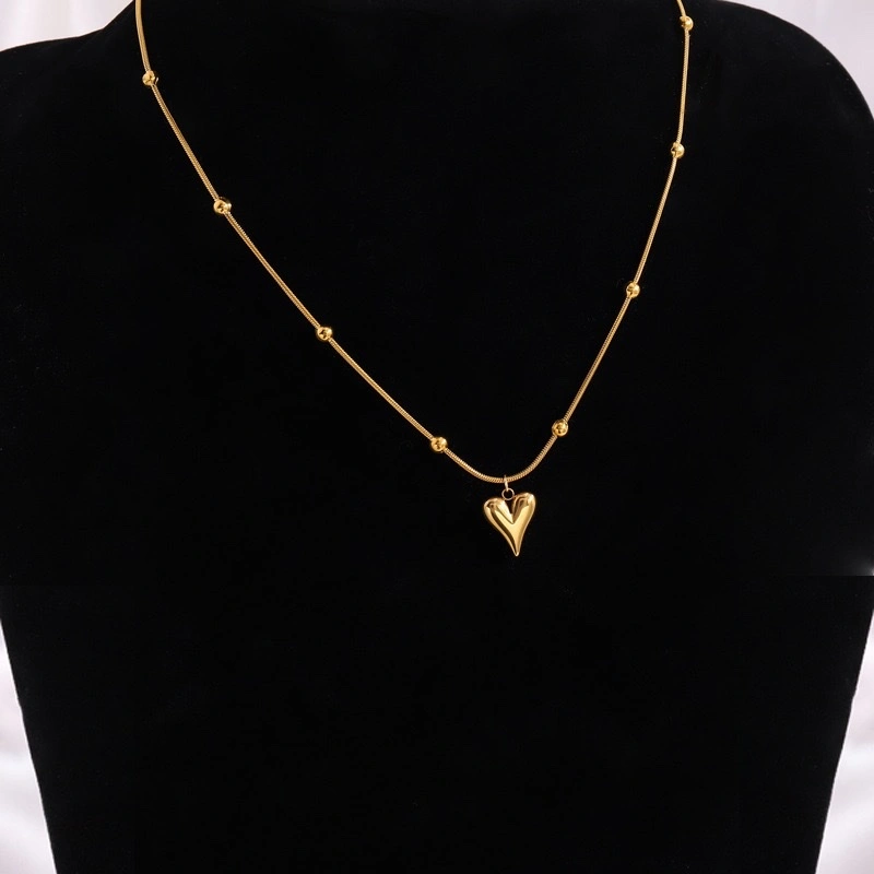 This necklace is a versatile and high-end stainless steel necklace with a fashionable European and American heart-shaped round bead snake bone chain. It is a personalized design accessory detail image 2