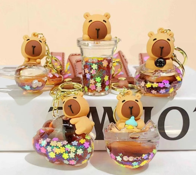 潮牌卡通创意亚克力入油流沙瓶.泡珠系.￼公仔系..水色系.颜色多色混.钥匙扣挂件.包包挂件、￼儿童书包挂件、