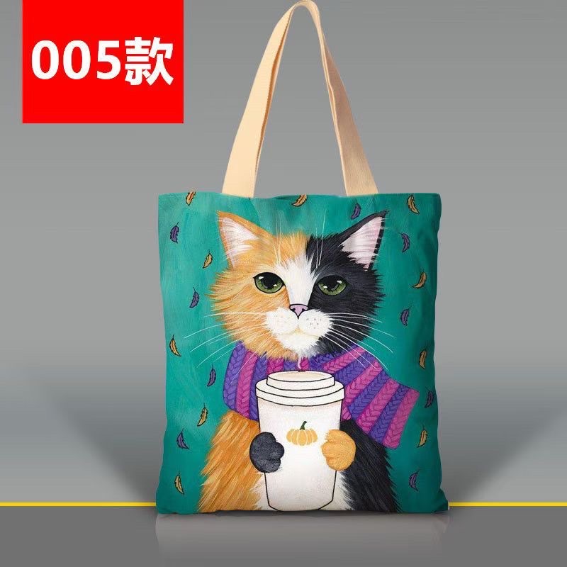 韩版卡通猫咪手提袋涤纶印花大容量女士单肩包外出双层环保购物袋白底实物图