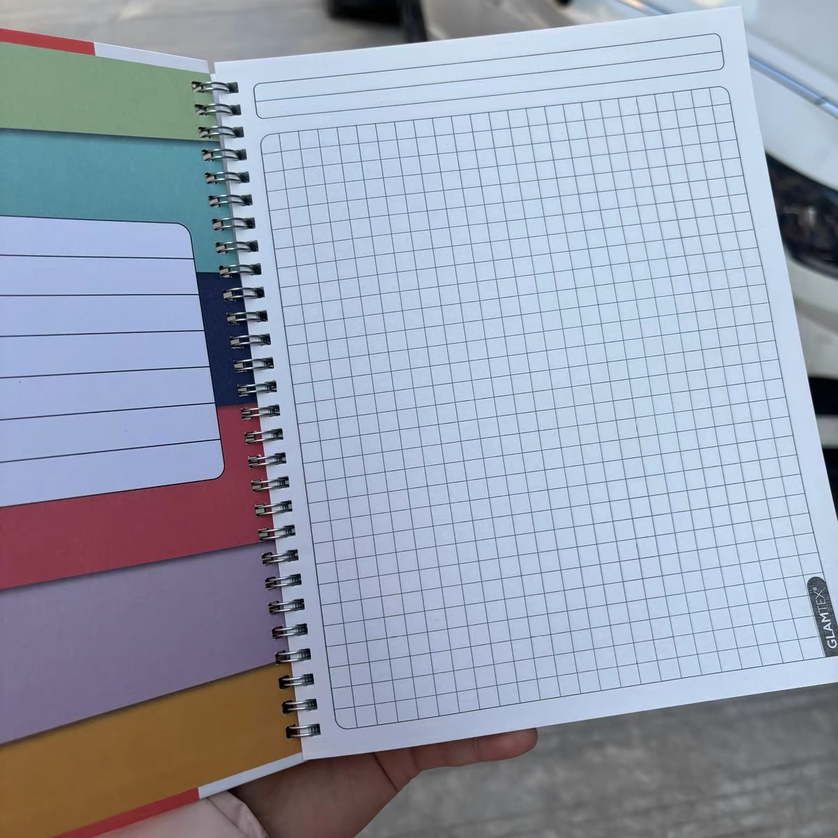 Customized foreign trade notebook and notepad, American A4 paper cover, coil grid notebook, light blue grid, black series, large grid notebook, cartoon coil planner notebook Application Scenario