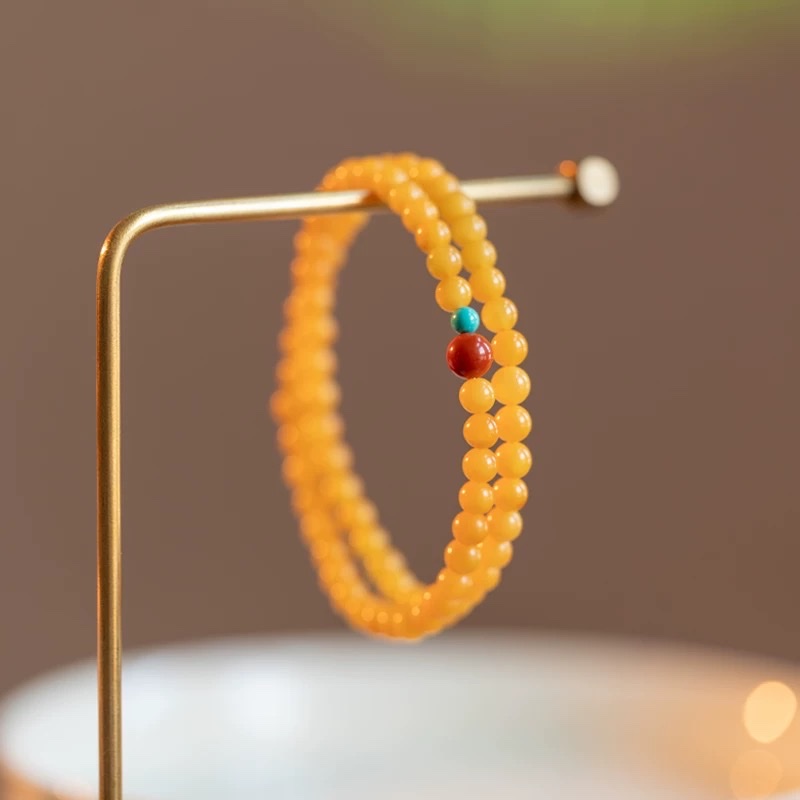 Natural amber and beeswax double-ring beeswax bracelet for women, double-layered Nan red turquoise multi-treasure bracelet, Russian chicken oil yellow multi-ring millet bead bracelet for women details Picture
