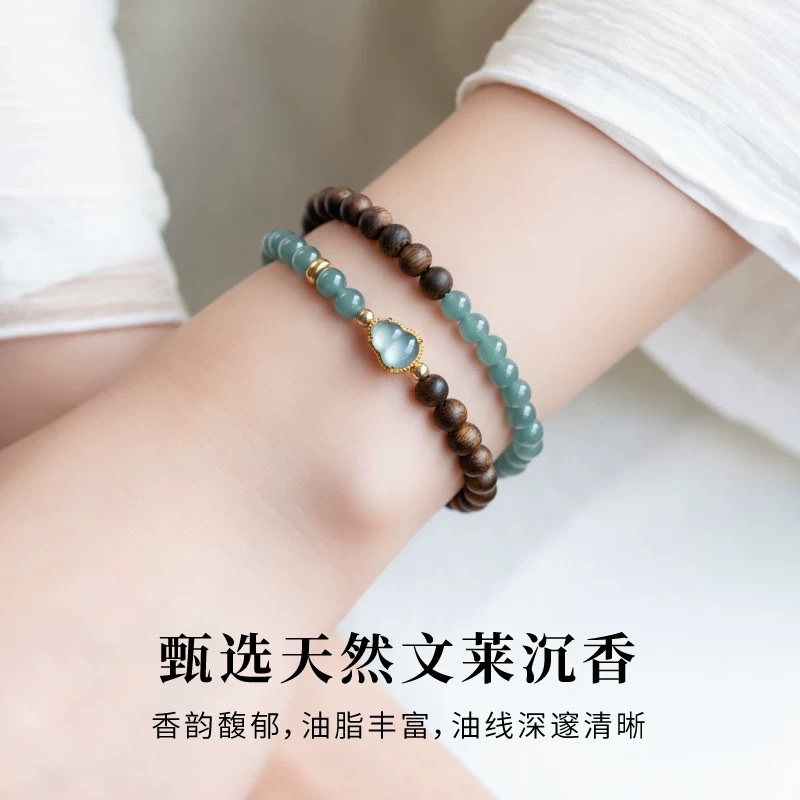 This is a natural agarwood bracelet with the same style as famous stars. It features a blue water jade double-ring bracelet and a female jade gourd with a 925 silver inlaid design details Picture