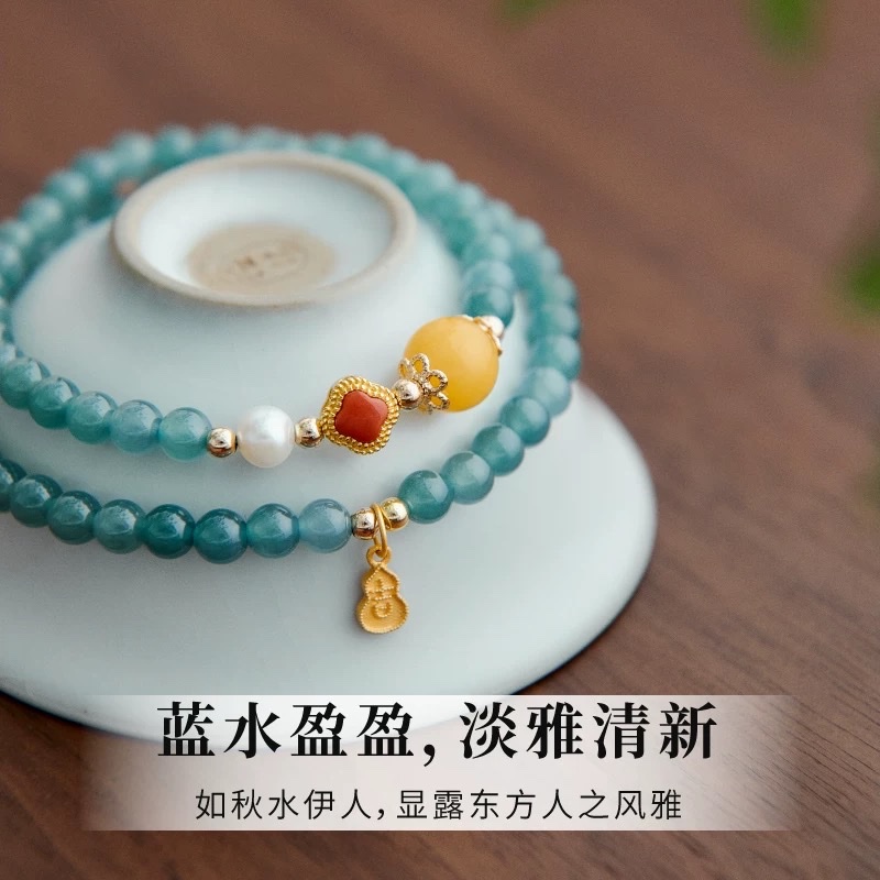 A blue water jade double-ring bracelet for women, stacked with natural crystal, high ice blue water droplets, beeswax, south red four-leaf clover, 925 silver auspicious plaque Application Scenario