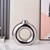 Minimalist modern electroplated silver ceramic vase, high-end decorative art piece, hollow round creative ceramic display piece, ceramic vase, ceramic details Picture