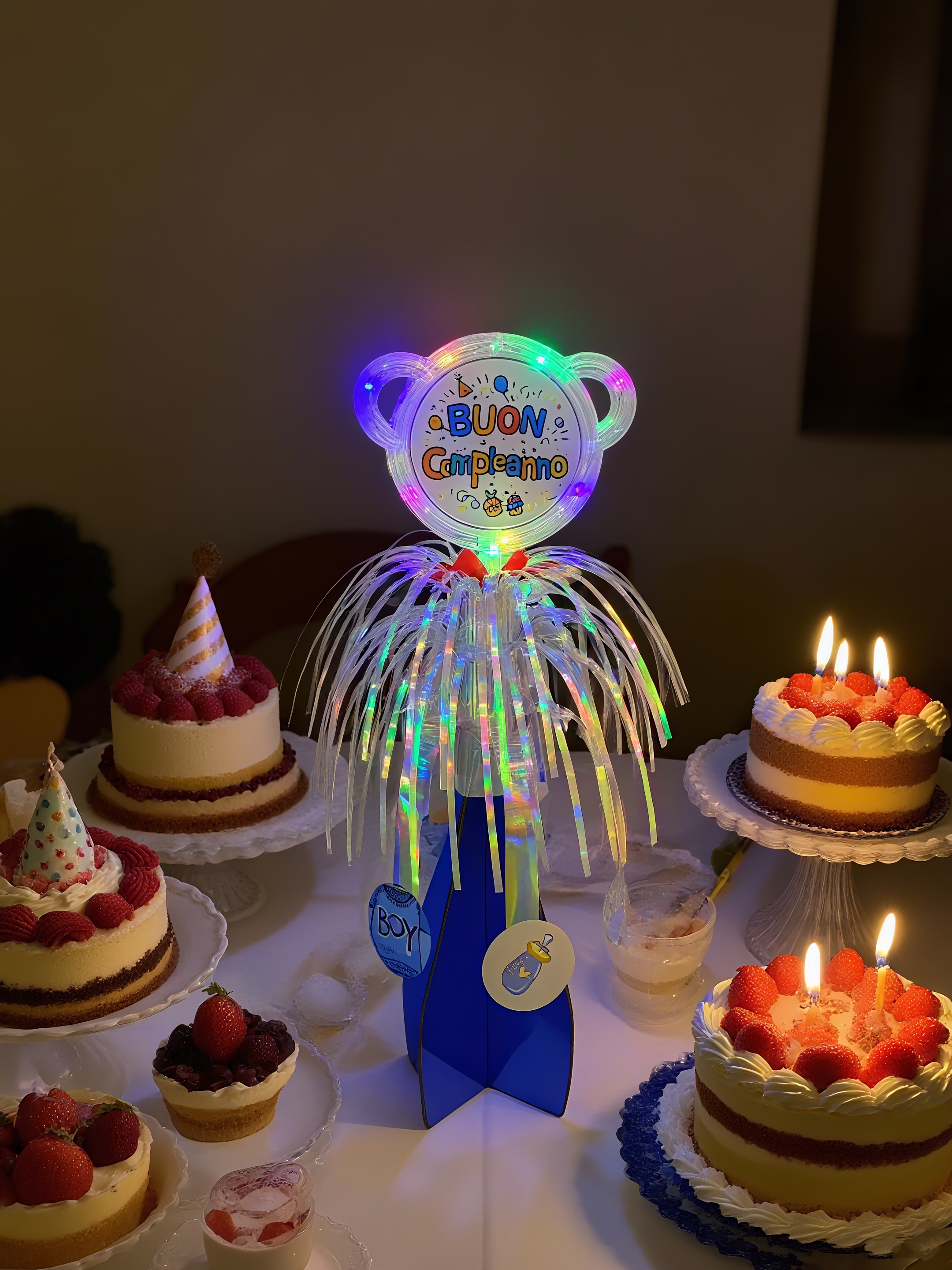 The birthday table is decorated with tassels that shine to illuminate the party supplies detail image 2
