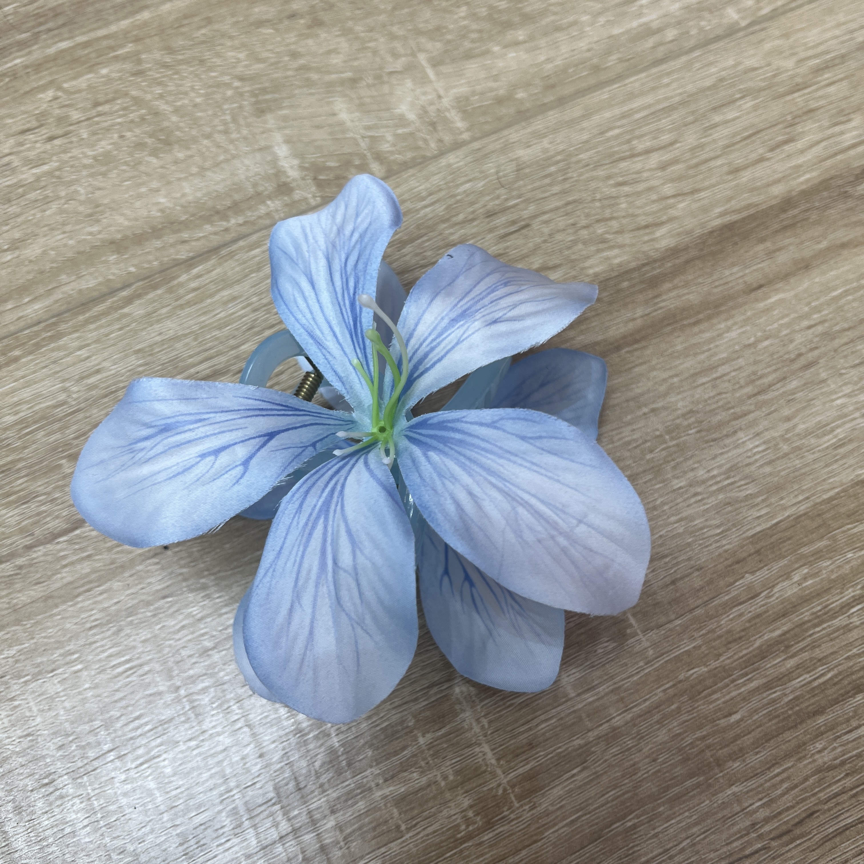 In 2025, a best-selling faux flower hairpin in South America, a large Hawaiian style peony flower hairpin for beach vacations