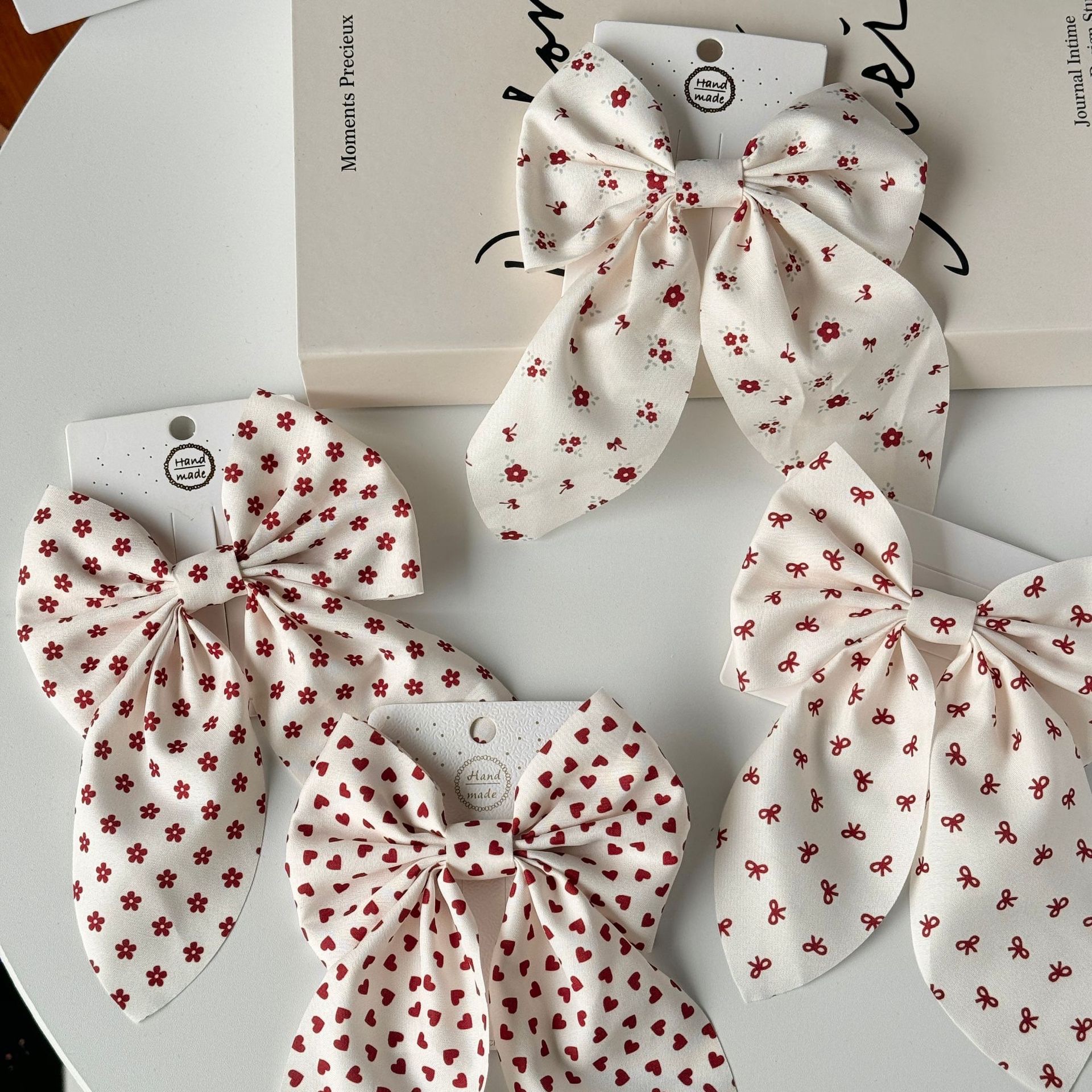 The new Angolan red bow hair clip is sweet and cute, and the ins cream white super fairy-like hair rope accessory detail image 6