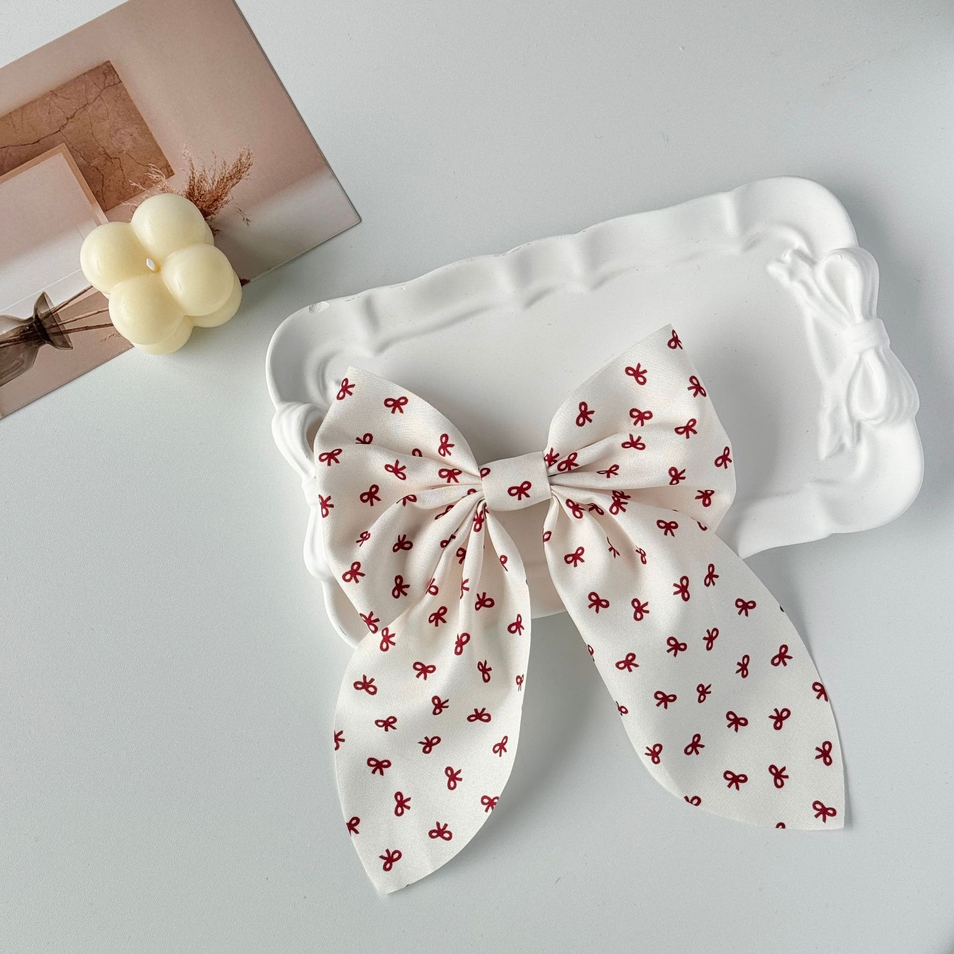 The new Angolan red bow hair clip is sweet and cute, and the ins cream white super fairy-like hair rope accessory detail image 2