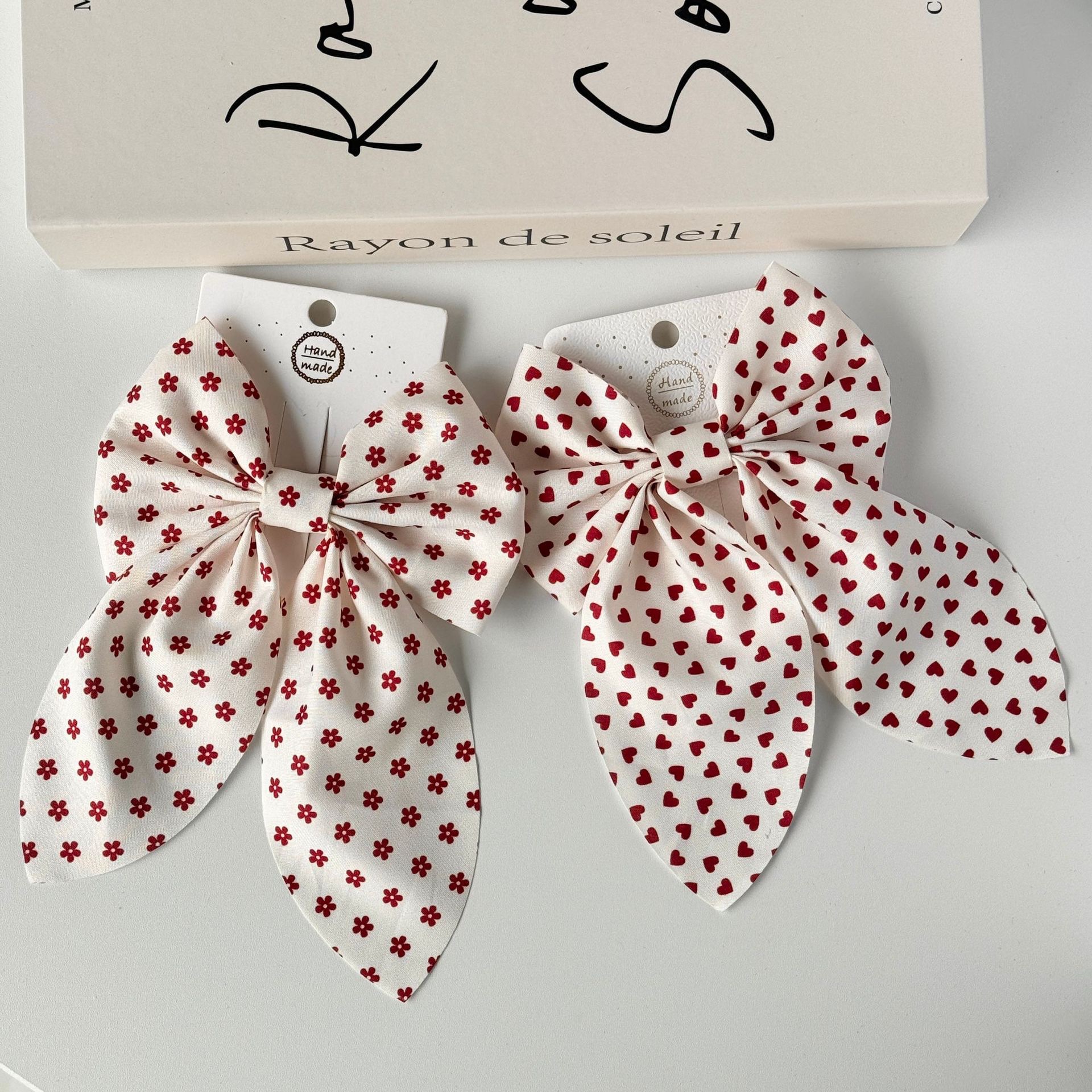 The new Angolan red bow hair clip is sweet and cute, and the ins cream white super fairy-like hair rope accessory detail image 5
