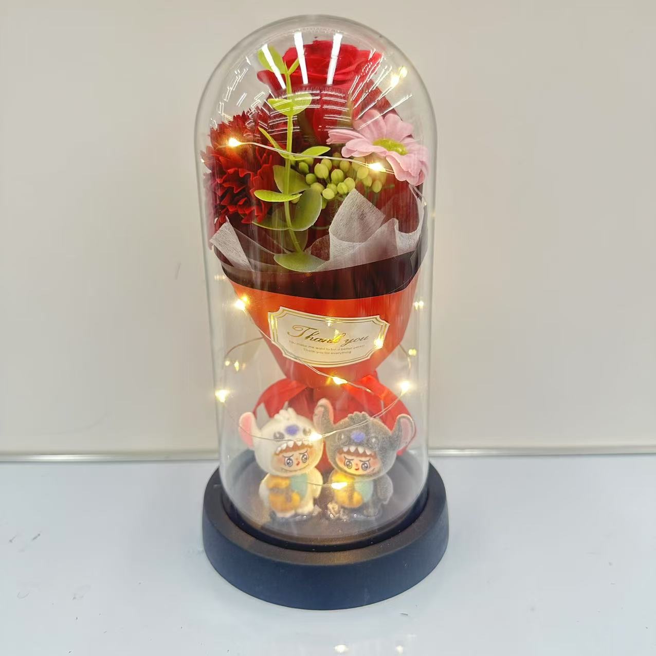 Glass-covered plastic flower figurine ornament