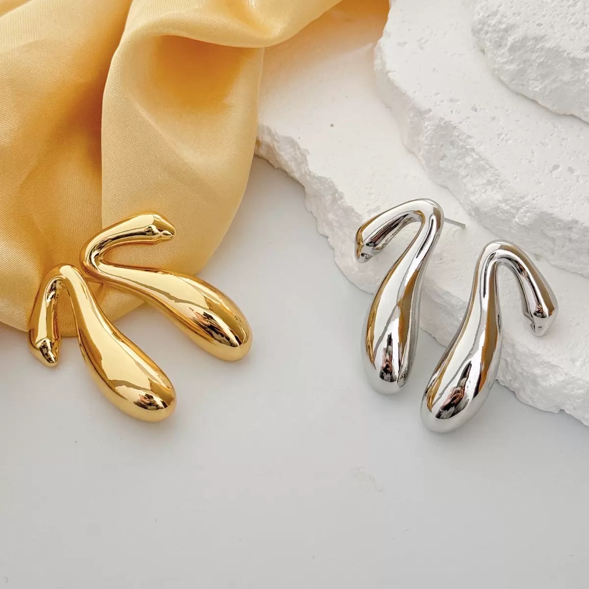 INS niche metal cold style hollow irregular stud earrings, European and American fashion cross-border high-end earrings for women