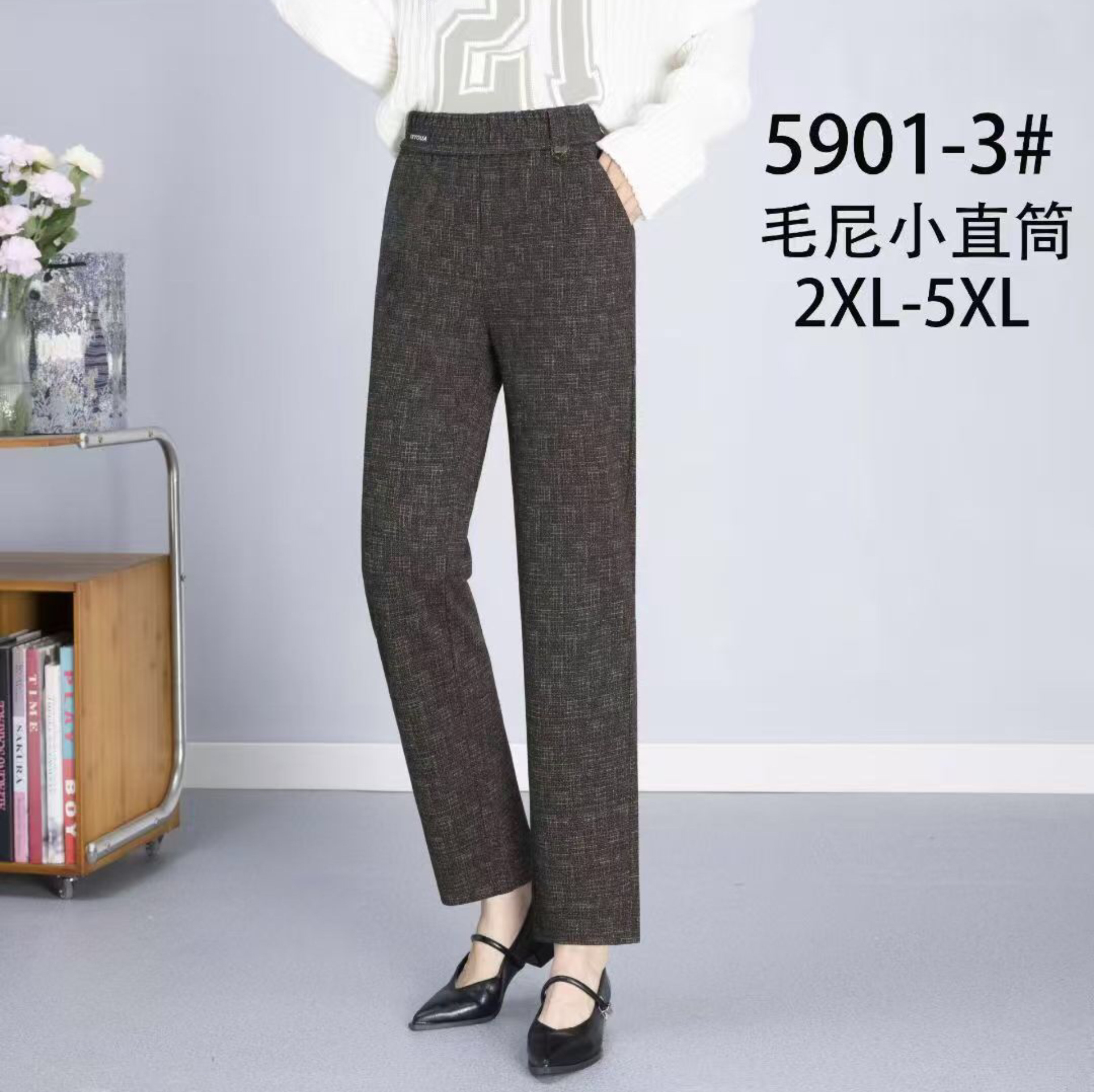 In the autumn and winter of 2025, this is a trendy women's trousers with a small leg, elastic waist, faux wool, and coffee-gray color