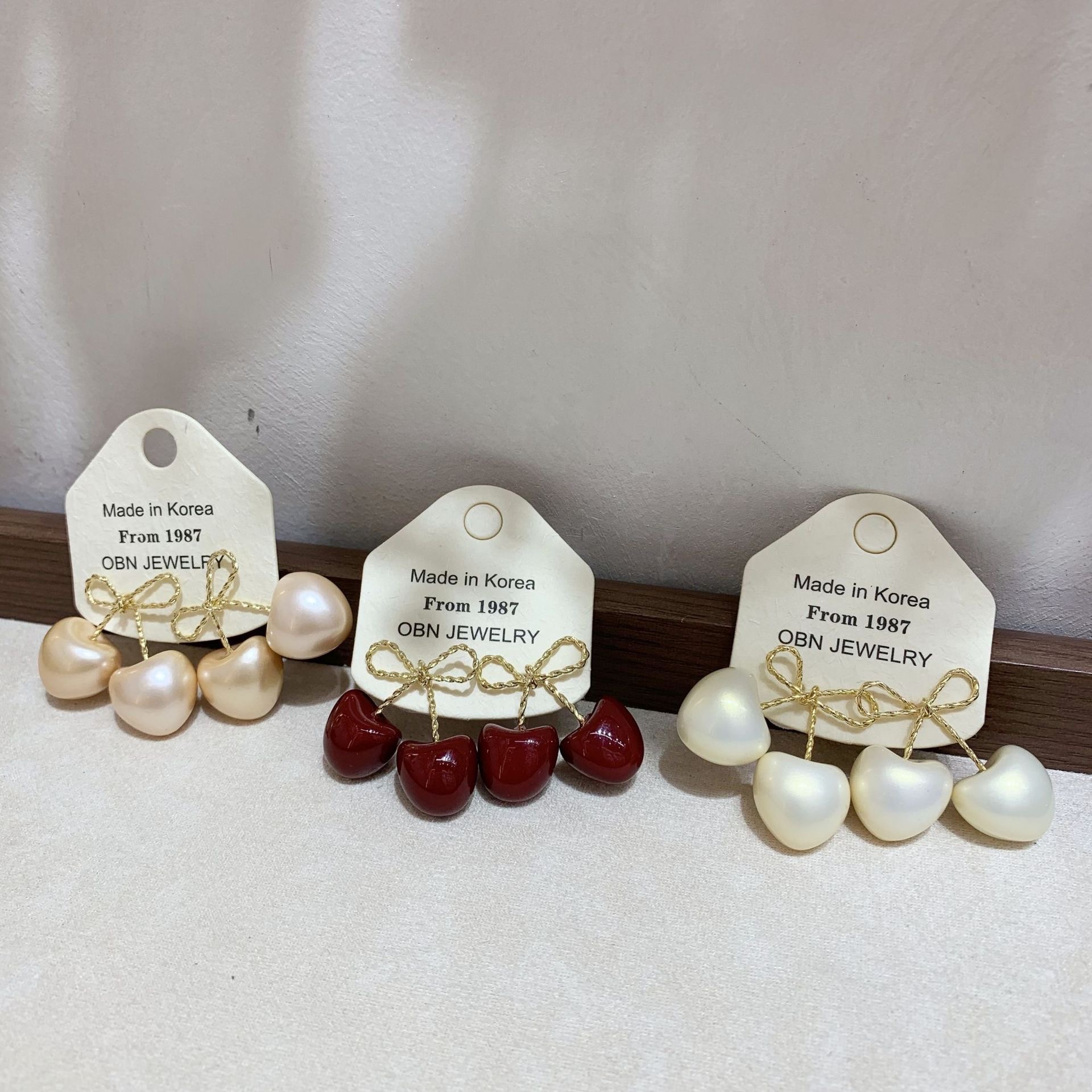 The new stylish bow, niche cherry stud design, red simple and fashionable earrings, sweet and cute Specification image