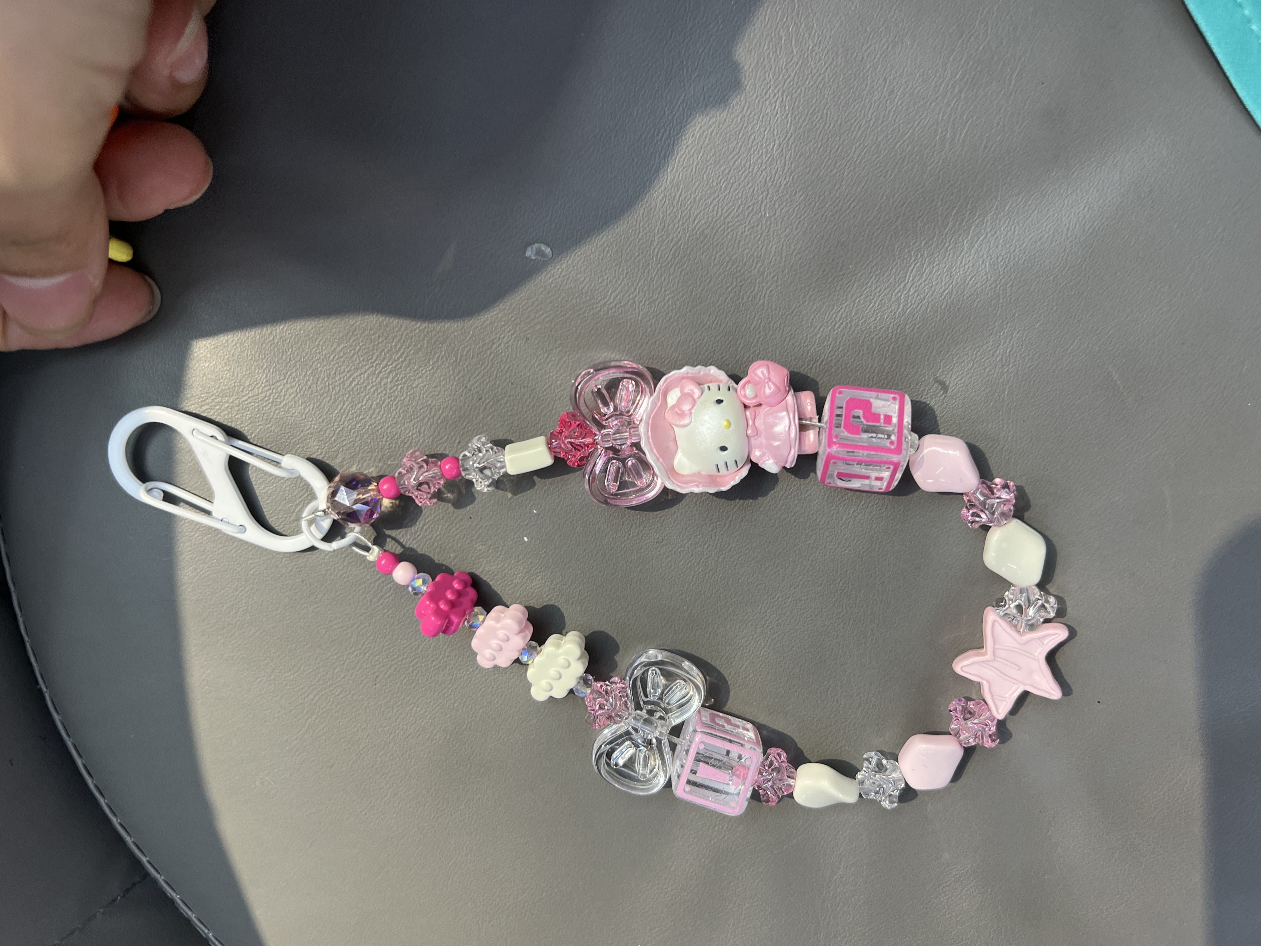 The latest trendy mobile phone pendants, bag pendants and clothing items