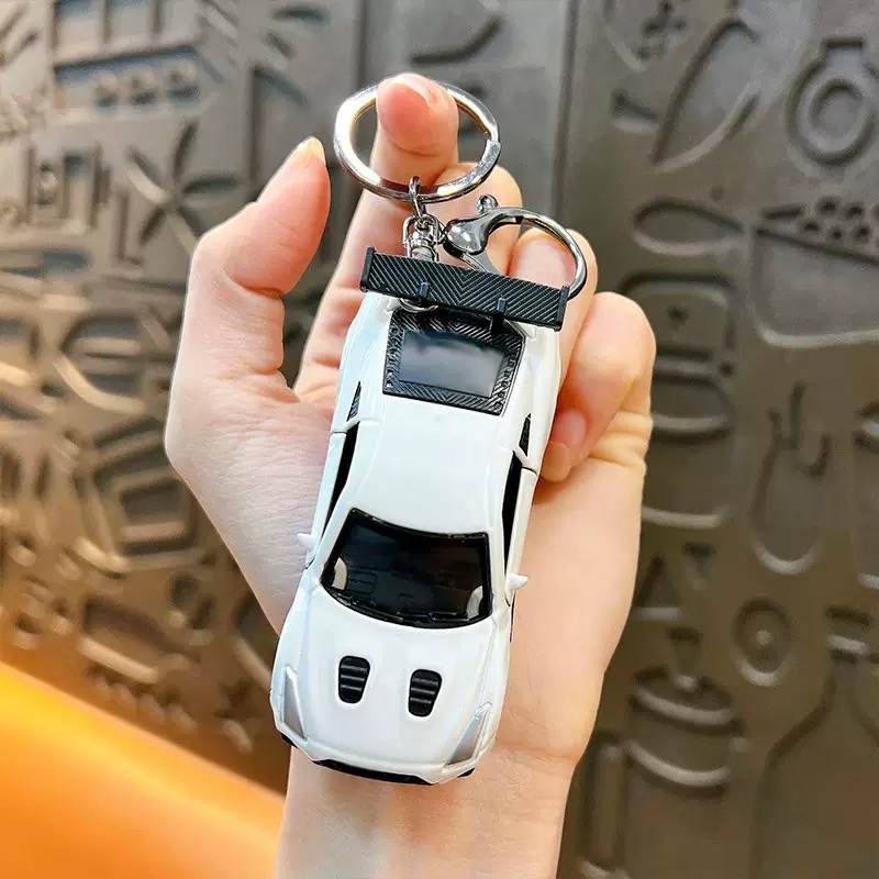 Creative Huili mini sports car keychain pendant, cartoon schoolbag, car hanging decoration, key chain, creative gift wholesale, keychain, keychain accessories detail image 2