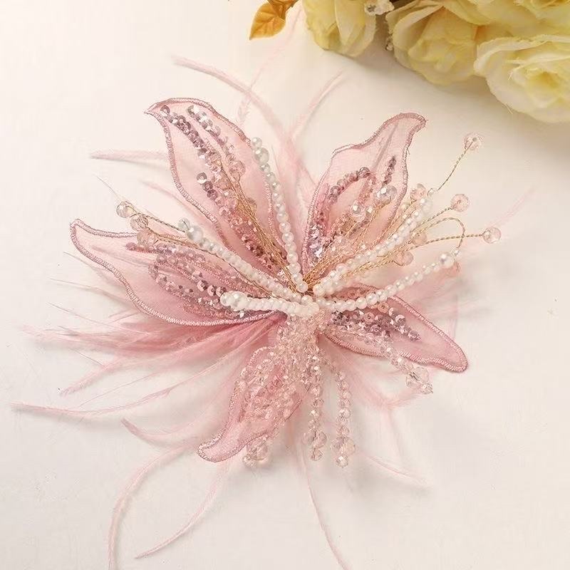 Original design wedding accessories, handcrafted white lace flowers, fairy-like feather borders, bride's photo studio and makeup head details Picture
