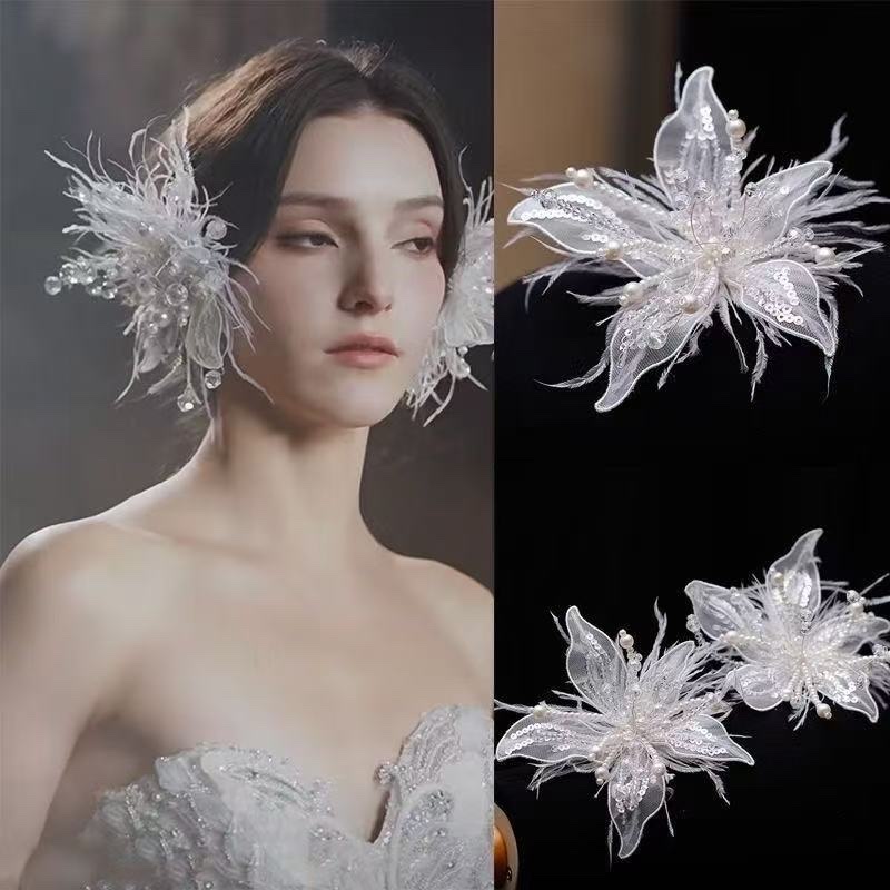 Original design wedding accessories, handcrafted white lace flowers, fairy-like feather borders, bride's photo studio and makeup head