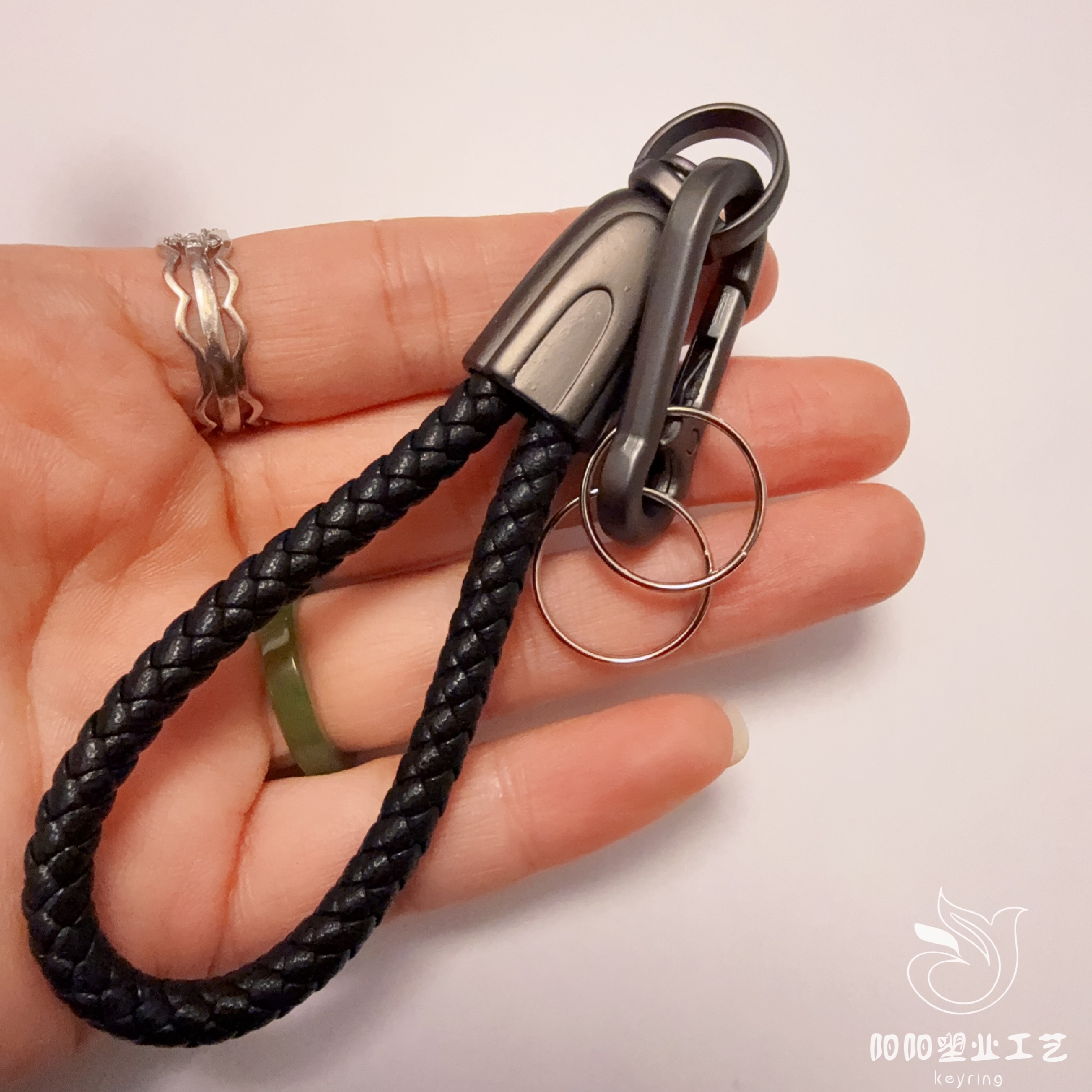 Hand-woven cowhide keychain pendant, genuine leather with embossed logo, high-quality lanyard, anti-loss car keychain Item Picture