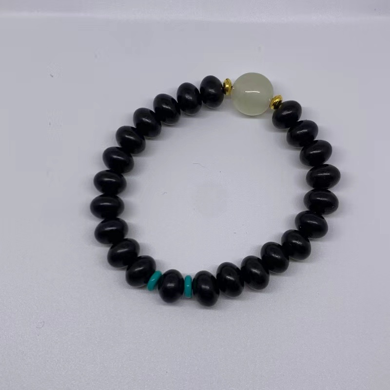 The new Chinese-style sandalwood oval bead plain ring cultural play Buddhist prayer bead bracelet weaving, the new favorite of cultural play bracelets: sandalwood with luminous beads, simple and elegant, fully demonstrating the charm of the East. detail image 2