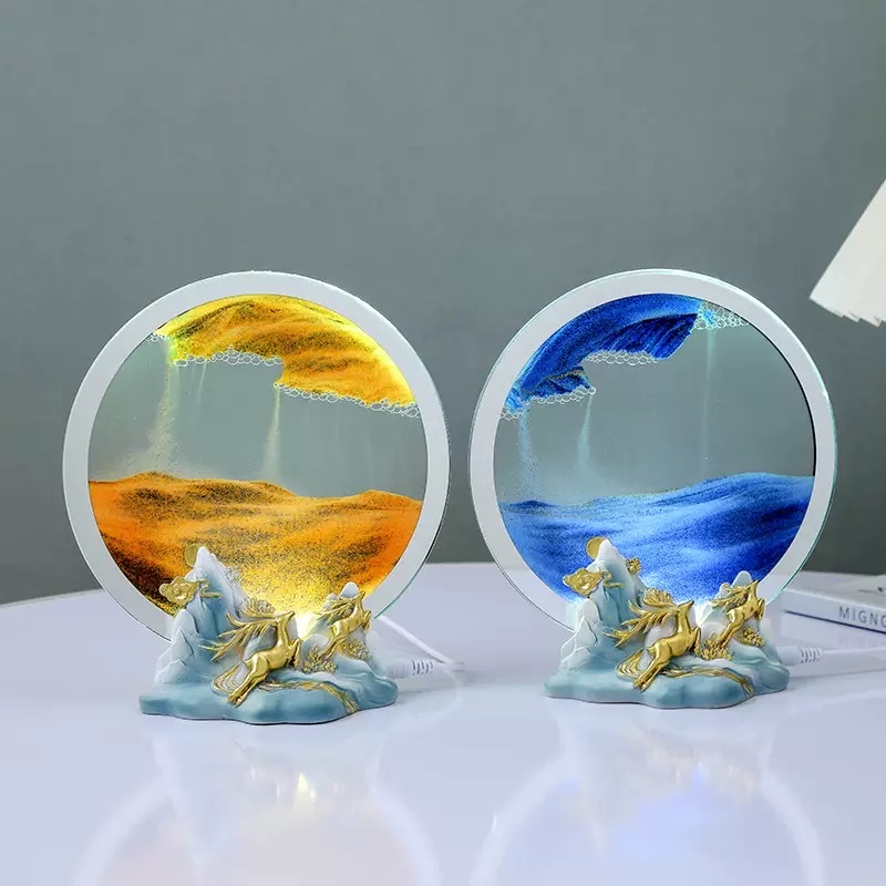A small night light ornament with a deer by the side of flowing sand