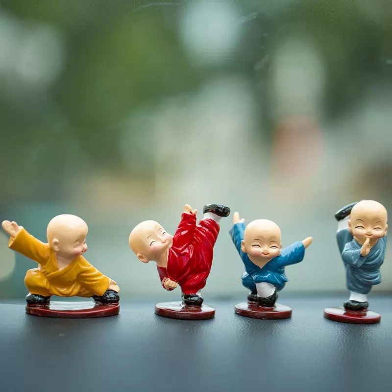 Four cute car accessories and interior decorations featuring Kung Fu monks, men's car center consoles, and Shaolin Kung Fu boys