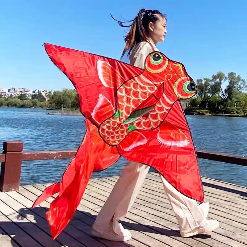 The new kite, Red Golden Fish, is a popular spring kite. It is an innovative kite specially designed for children and adults, featuring a gentle breeze and easy flight Application Scenario